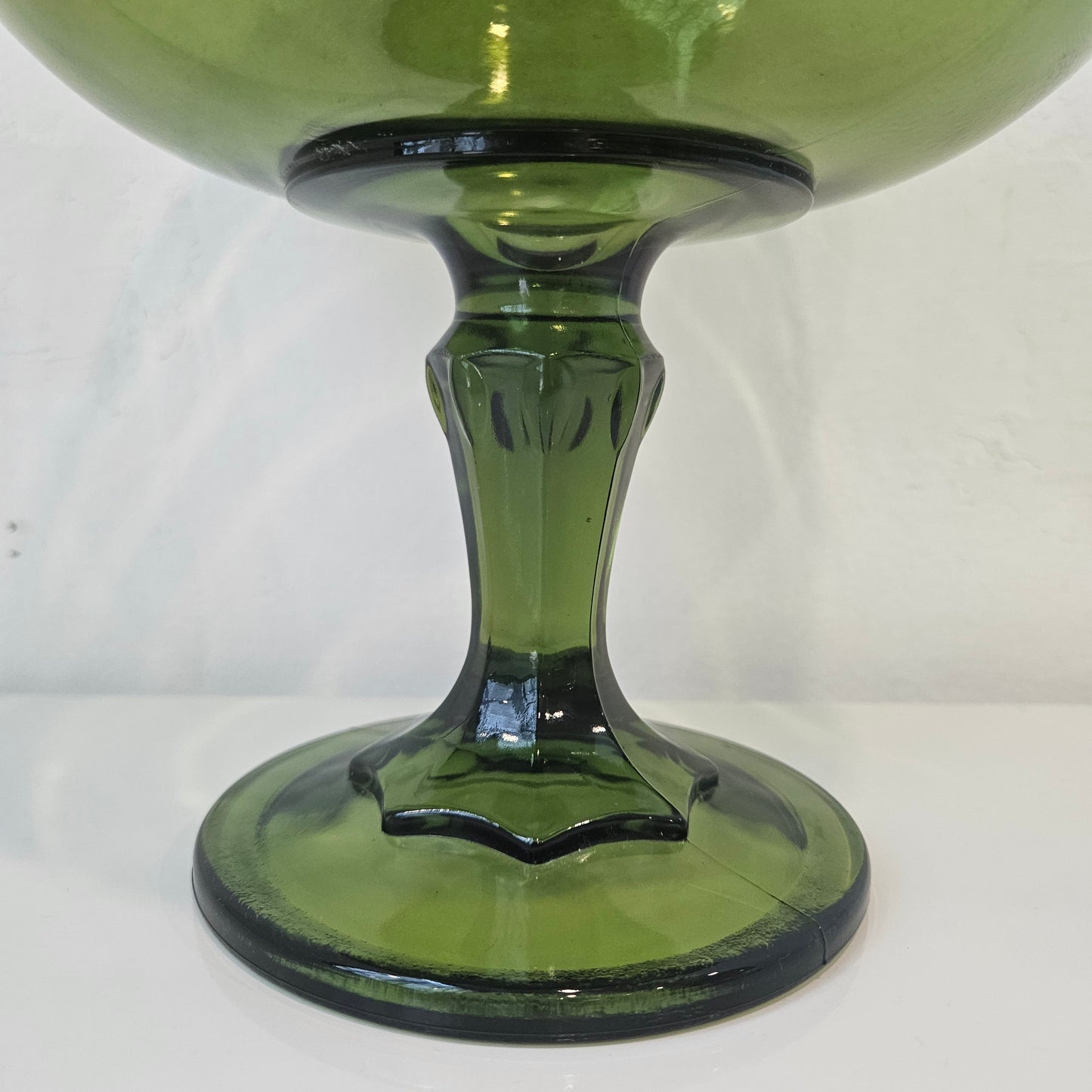 Footed green glass bowl